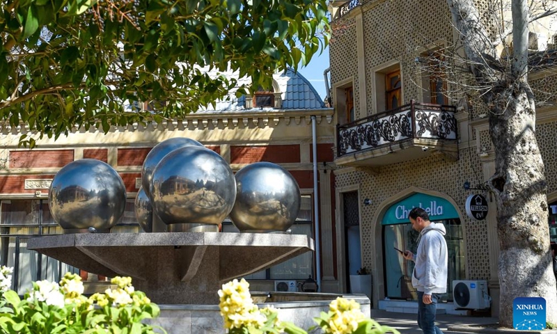 A man walks on a street in Ganja, Azerbaijan, on March 24, 2026. Ganja is Azerbaijan's second-largest city and one of the countries' historic sites. (Xinhua/Chen Junfeng)

