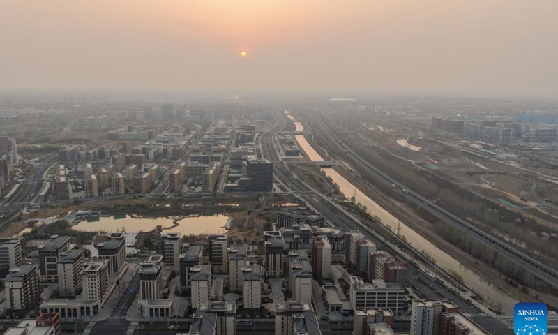 An aerial drone photo taken on March 27, 2026 shows the sunrise scenery in Xiong'an New Area, north China's Hebei Province. (Xinhua/Xing Guangli)