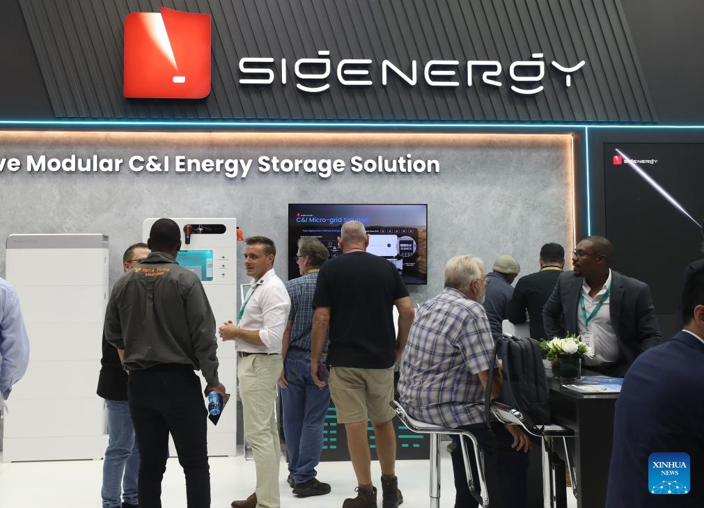 Visitors learn about products at the booth of Sigenergy Technology Co., Ltd. during the Solar and Storage Live Africa 2026 in Johannesburg, South Africa, March 25, 2026. Chinese renewable energy giants are hogging the spotlight at the ongoing Solar and Storage Live Africa 2026 in Johannesburg, South Africa, highlighting China's growing role in Africa's rapidly expanding clean energy sector. (Xinhua/Chen Wei)