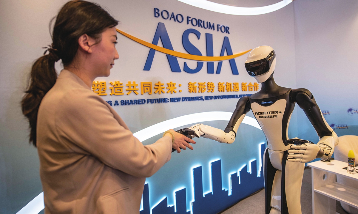 A humanoid robot interacts with an audience at the 2026 Boao Forum for Asia in Qionghai, South China's Hainan Province, on March 25, 2026. Photo: VCG