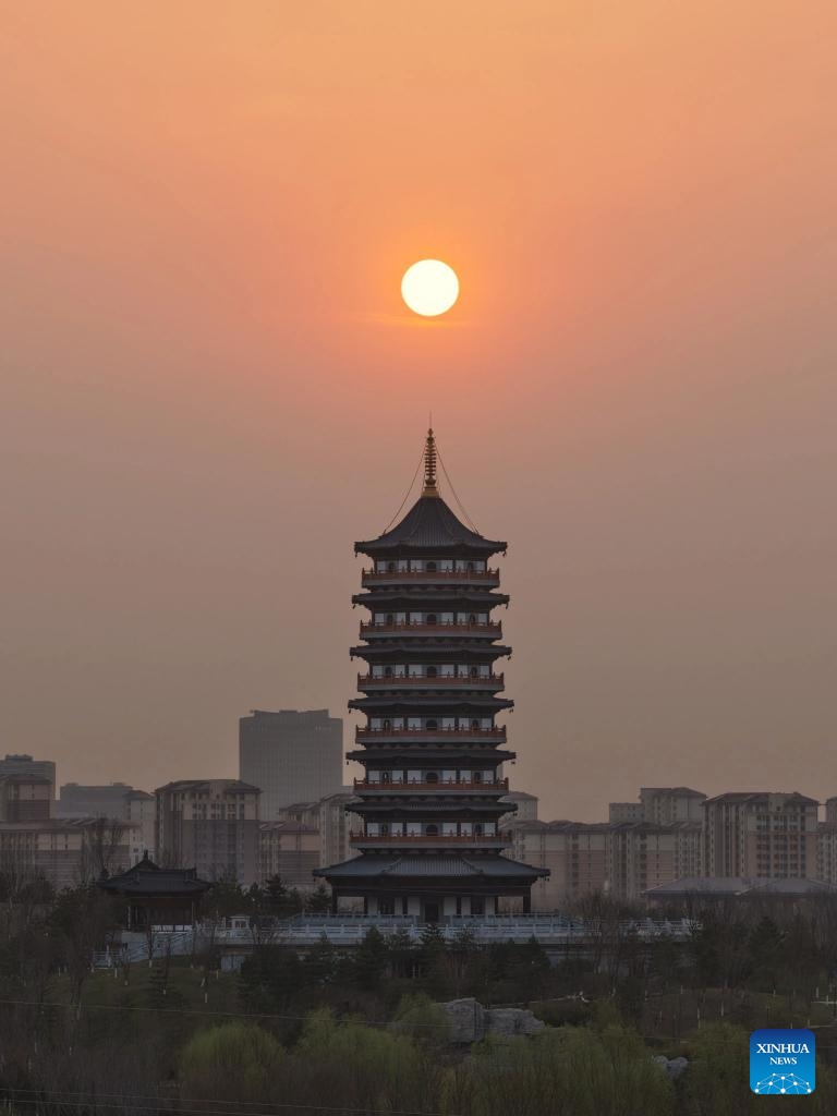 An aerial drone photo taken on March 27, 2026 shows the sunrise scenery in Xiong'an New Area, north China's Hebei Province. (Xinhua/Xing Guangli)
