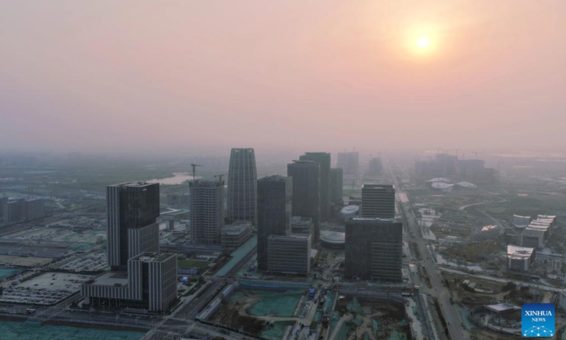 An aerial drone photo taken on March 27, 2026 shows the sunrise scenery in Xiong'an New Area, north China's Hebei Province. (Xinhua/Xing Guangli)