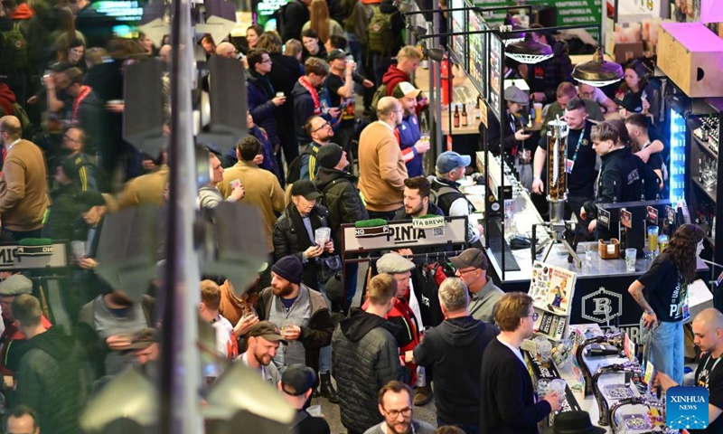 People visit the 21st Warsaw Beer Festival in Warsaw, Poland on March 26, 2026. The festival runs from March 26 to 28. (Photo by Aleksy Witwicki/Xinhua)

