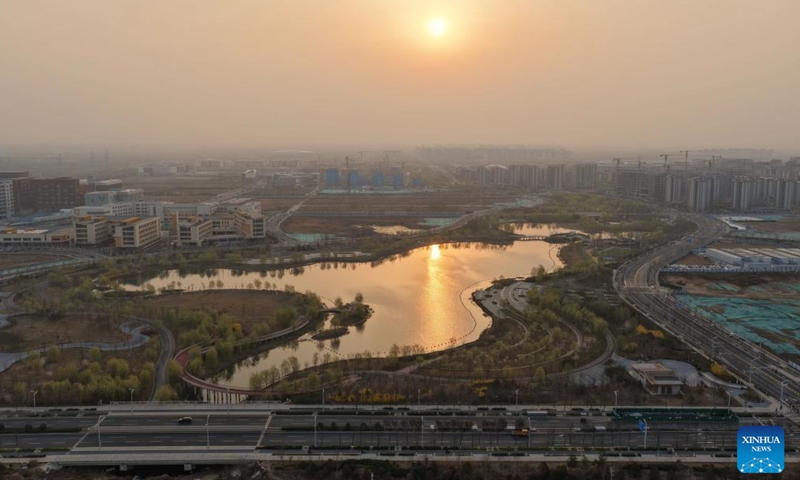 An aerial drone photo taken on March 27, 2026 shows the sunrise scenery in Xiong'an New Area, north China's Hebei Province. (Xinhua/Xing Guangli)