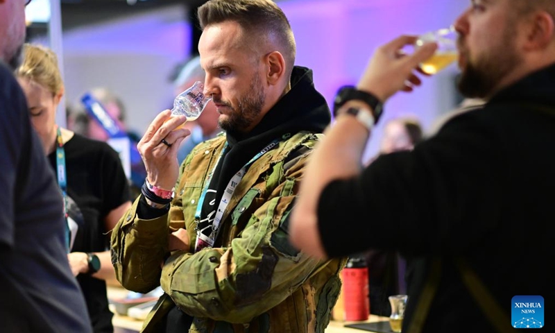 Visitors taste craft beer during the 21st Warsaw Beer Festival in Warsaw, Poland on March 26, 2026. The festival runs from March 26 to 28. (Photo by Aleksy Witwicki/Xinhua)

