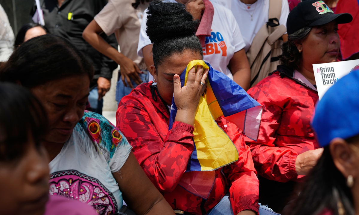 People react during a government-organized event to watch Venezuelan President Nicolas Maduro and First Lady Cilia Flores appear in a New York court on a screen in Caracas, Venezuela, on March 26, 2026. Photo: VCG