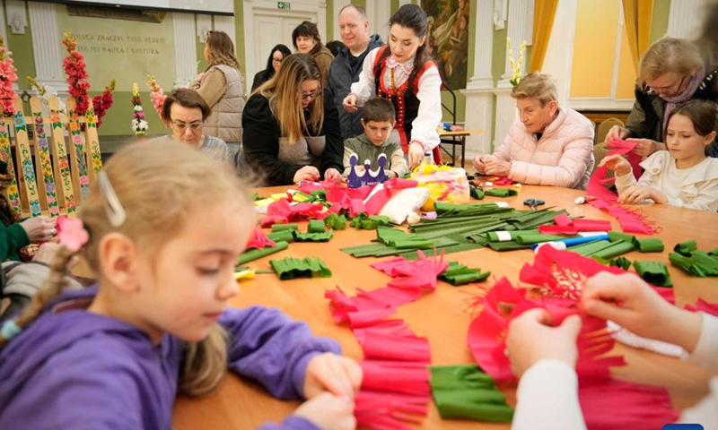 People make Easter decorations at an Easter fair in Warsaw, Poland, March 28, 2026. Various Polish handicrafts and cultural activities were presented at the event held by the Polish National Institute of Culture and Rural Heritage in Warsaw. (Photo by Jaap Arriens/Xinhua)