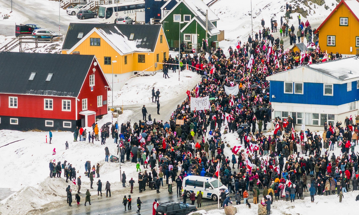 An aerial view shows people taking part in a demonstration to protest against the US' plans to take Greenland, on January 17, 2026, in Nuuk, Greenland. Photo: VCG