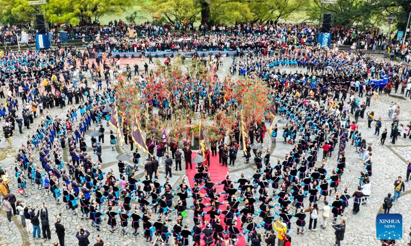 A drone photo shows local people attending the Sama Festival celebration event in Sanbao Dong Village in Rongjiang County, southwest China's Guizhou Province, March 28, 2026. Sama was the name of a heroine in ancient maternal society of Dong people. The Sama Festival, enlisted as one of the national intangible cultural heritages in 2006, is held to commemorate their ancestor. (Photo by Wei Guijin/Xinhua)