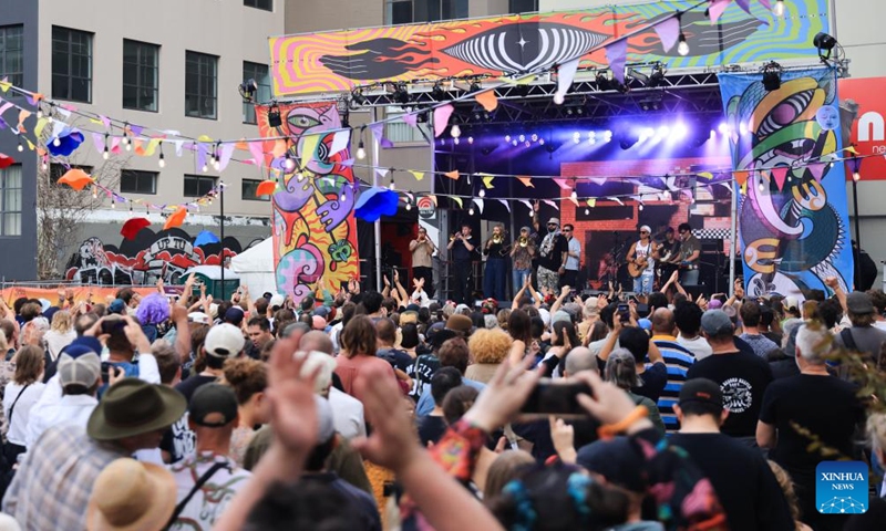 People watch a performance during CubaDupa Festival in Wellington, New Zealand, March 28, 2026. (Photo by Meng Tao/Xinhua)