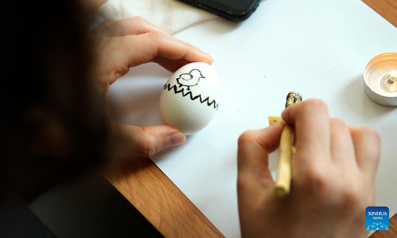 A woman decorates an Easter egg during an Easter fair in Warsaw, Poland, March 28, 2026. Various Polish handicrafts and cultural activities were presented at the event held by the Polish National Institute of Culture and Rural Heritage in Warsaw. (Photo by Jaap Arriens/Xinhua)