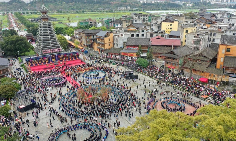 A drone photo shows local people attending the Sama Festival celebration event in Sanbao Dong Village in Rongjiang County, southwest China's Guizhou Province, March 28, 2026. Sama was the name of a heroine in ancient maternal society of Dong people. The Sama Festival, enlisted as one of the national intangible cultural heritages in 2006, is held to commemorate their ancestor. (Photo by Wei Guijin/Xinhua)