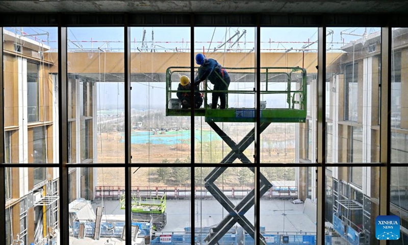 Staff members of China Construction Third Engineering Bureau Group Co., Ltd. work at the construction site of the headquarters of China Mineral Resources Group Ltd. in Xiong'an New Area, north China's Hebei Province, March 25, 2026. Photo:Xinhua