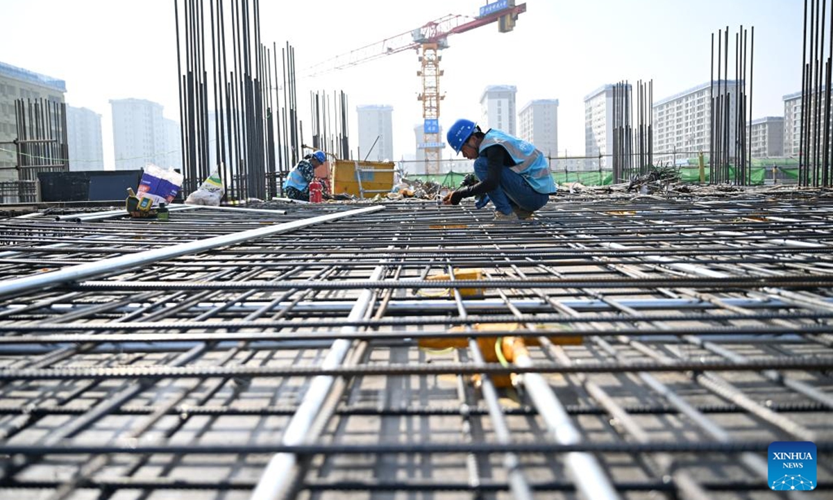 A staff member of the China Construction Second Engineering Bureau Ltd. works at the construction site of the Xiong'an campus of the University of Science and Technology Beijing in Xiong'an New Area, north China's Hebei Province, March 25, 2026.

About an hour's drive from Beijing, a futuristic city is rising on the North China Plain -- the Xiong'an New Area.

The area aims to relieve Beijing of non-essential functions related to its status as the nation's capital while also advancing the coordinated development of the Beijing-Tianjin-Hebei region.(Xinhua/Mu Yu)