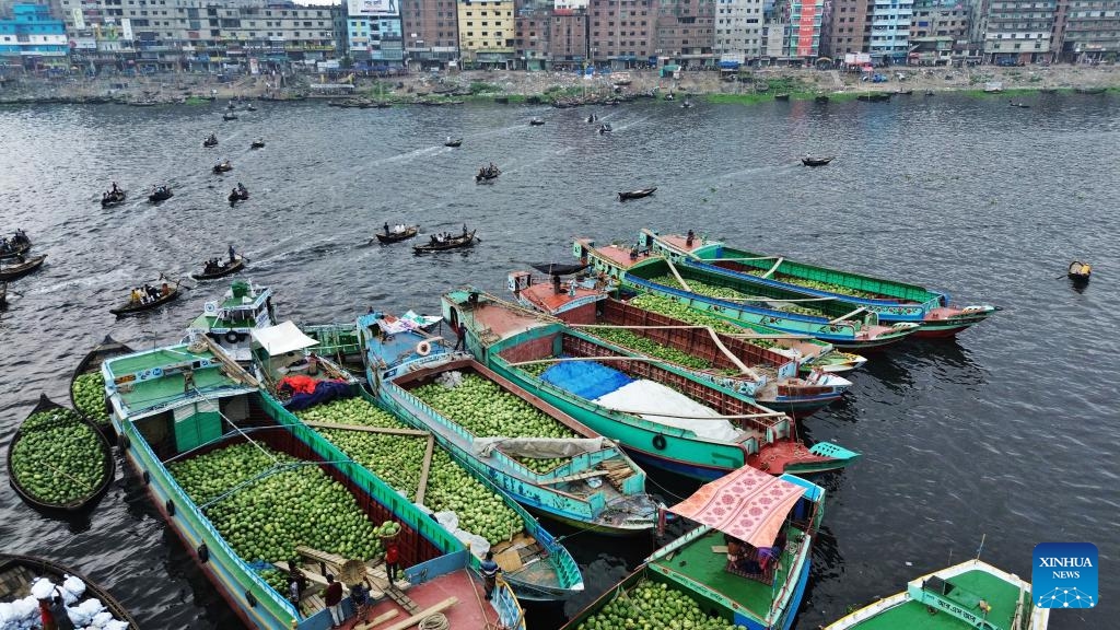 Workers unload watermelons from boats at Sadarghat in Dhaka, Bangladesh, March 30, 2026. (Photo by Habibur Rahman/Xinhua)

