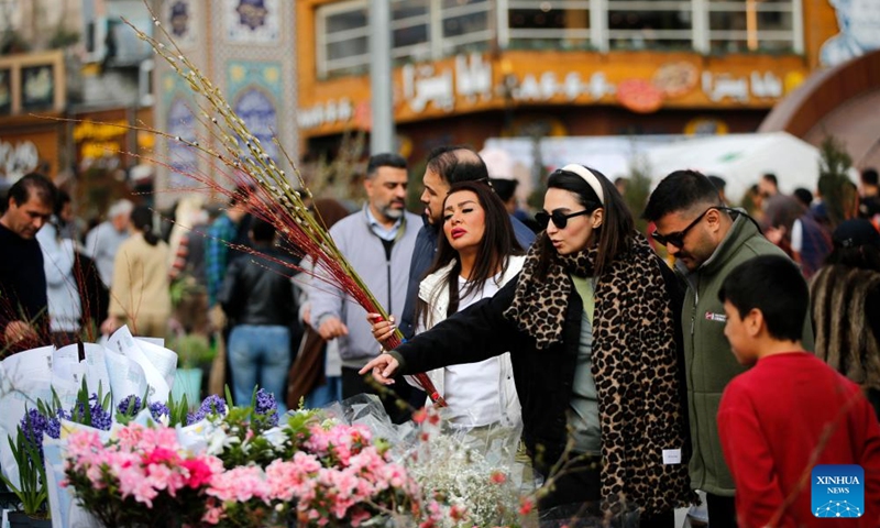 People buy flowers ahead of Nowruz at Tajrish Bazaar in Tehran, Iran, March 19, 2026. The U.S.-Israel-Iran conflict entered its 30th day on Sunday, with no end to the war in sight. People in Tehran and Tel Aviv spent day and night amid sirens and explosions, facing devastation caused by the conflict while longing for a peaceful life. (Xinhua)