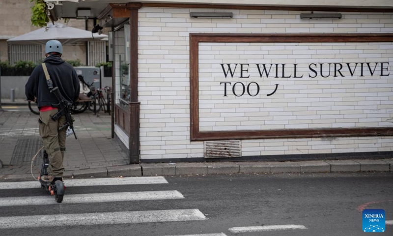 An armed reserve soldier rides a scooter across the street in Tel Aviv, Israel, March 26, 2026. The U.S.-Israel-Iran conflict entered its 30th day on Sunday, with no end to the war in sight. People in Tehran and Tel Aviv spent day and night amid sirens and explosions, facing devastation caused by the conflict while longing for a peaceful life. (Xinhua/Chen Junqing)