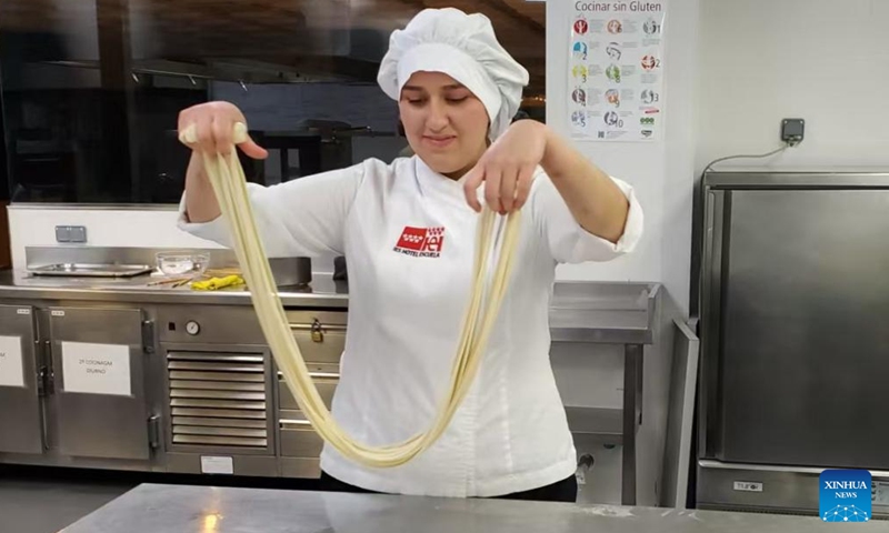 A local vocational student of an international Lamian beef noodle chef training program practises making beef noodles at the I.E.S. Hotel Escuela in Madrid, Spain, in January 2026. (Lanzhou Resource and Environment Vocational and Technical University/Handout via Xinhua)

