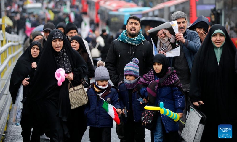 People take part in a rally in Tehran, Iran, March 13, 2026. The U.S.-Israel-Iran conflict entered its 30th day on Sunday, with no end to the war in sight. People in Tehran and Tel Aviv spent day and night amid sirens and explosions, facing devastation caused by the conflict while longing for a peaceful life. (Xinhua)