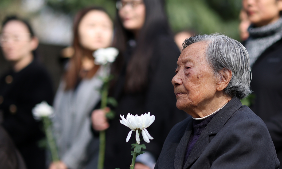 Xia Shuqin, a Nanjing Massacre survivor, pays tribute to the victims of the Nanjing Massacre in Nanjing on April 4, 2025. Photos on this page: VCG