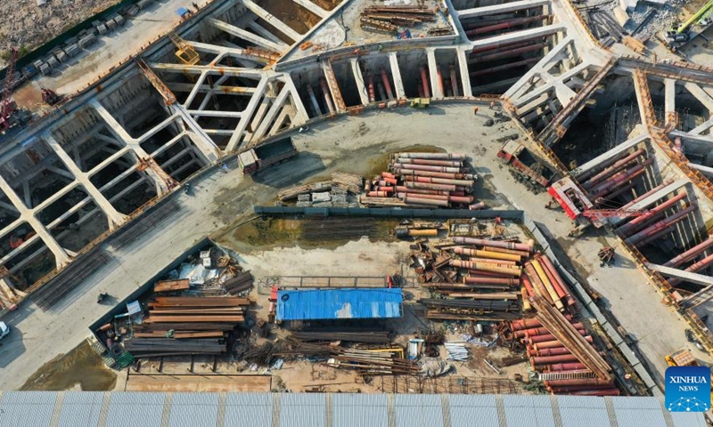 An aerial drone photo taken on March 31, 2026 shows a view of the construction site of the Sanya River estuary passage project in Sanya, south China's Hainan Province. This 3.118-kilometer underwater tunnel, the first of its kind in Sanya, is expected to further optimize the urban spatial layout of the city, and facilitate the development of the Hainan Free Trade Port. (Xinhua/Yang Guanyu)


