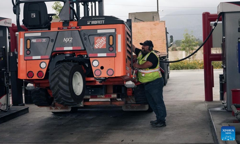 A driver fills up his truck at a gas station in Monrovia, Los Angeles County, California, the United States, March 31, 2026. The average cost of a gallon of diesel in California on Tuesday reached an all-time high of 7.455 U.S. dollars as the U.S.-Israel war on Iran enters its second month. (Photo by Zeng Hui/Xinhua)

