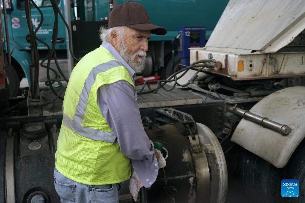 A driver fills up his truck at a gas station in Monrovia, Los Angeles County, California, the United States, March 31, 2026. The average cost of a gallon of diesel in California on Tuesday reached an all-time high of 7.455 U.S. dollars as the U.S.-Israel war on Iran enters its second month. (Photo by Zeng Hui/Xinhua)


