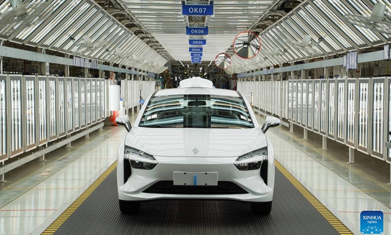 This photo taken on July 18, 2023 shows a production line at a workshop of the manufacturing base of Jiangling Motors Co., Ltd. in Nanchang City, east China's Jiangxi Province. (Xinhua/Zhou Mi)

