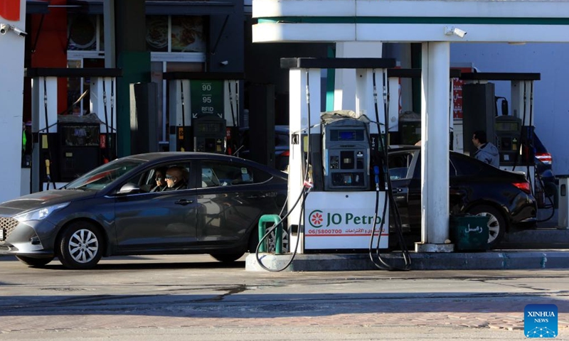 Vehicles refuel at a gas station in Amman, Jordan, on March 31, 2026. Jordan on Tuesday raised fuel prices for April, its first increase since the regional conflict began, while absorbing part of the global price hike to limit the impact on consumers, according to the Jordanian Ministry of Energy and Mineral Resources. (Photo by Mohammad Abu Ghosh/Xinhua)

