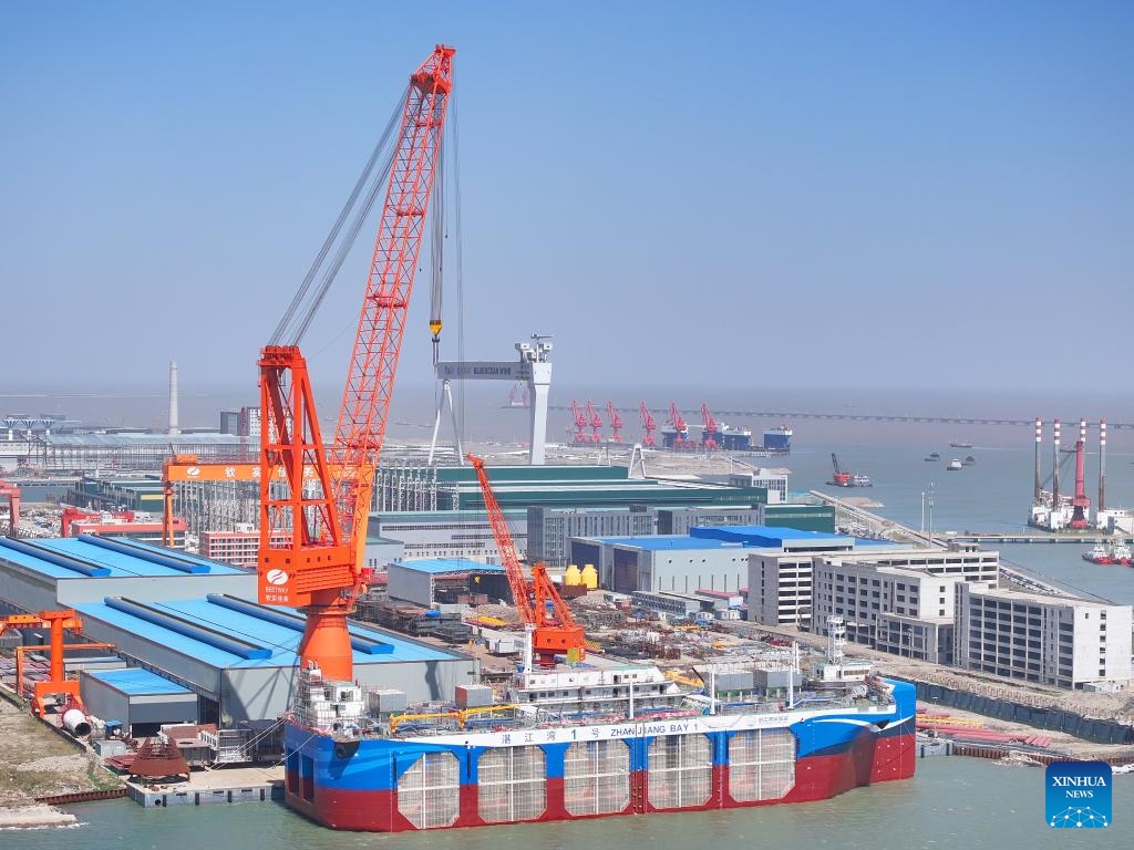 An aerial drone photo taken on April 14, 2025 shows a view of an industrial park at Tongzhou Bay in Nantong, east China's Jiangsu Province. In recent years, Nantong has scaled up efforts to improve the water conservancy system, coupled with its green development endeavors in river basins and seaside areas. (Photo by Xu Congjun/Xinhua)

