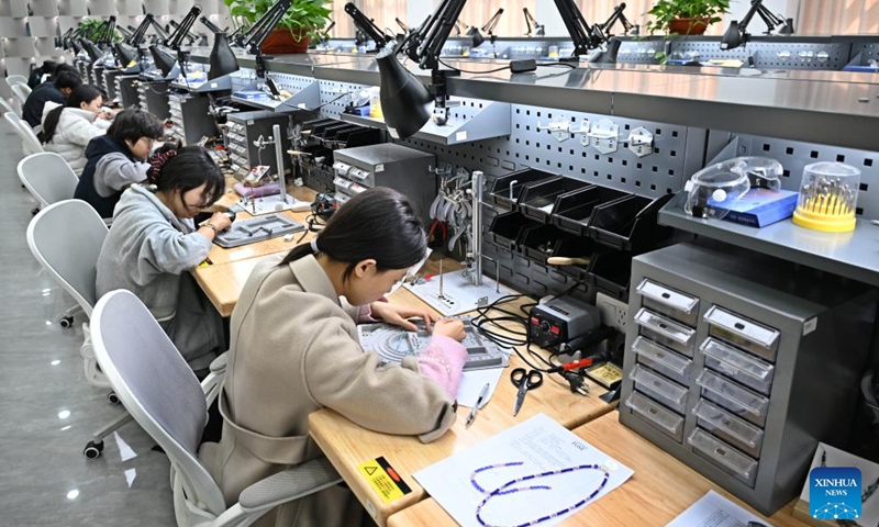 Students practice jewelry processing skills at a class in Qingdao Preschool Education College in Qingdao, east China's Shandong Province, March 31, 2026. (Xinhua/Li Ziheng)