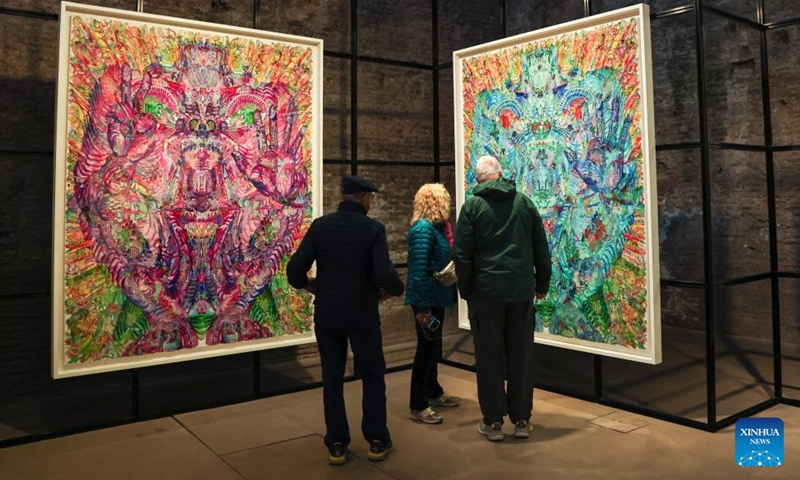 People visit the exhibition Metamorphosis in Baths of Diocletian of the National Roman Museum in Rome, Italy, April 1, 2026. The exhibition presents the contemporary Chinese artist Wu Jian'an's reflection on the theme of transformation through a dialogue between Eastern and Western traditions. (Xinhua/Wang Kaiyan)

