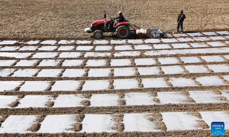 A farmer operates farm machinery during spring plowing in a field of Mali Town, Wushan County, Tianshui City, northwest China's Gansu Province, April 1, 2026. (Photo by Wang Kexian/Xinhua)

