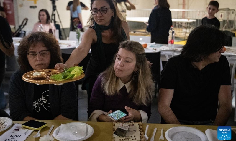People hold a Passover Seder at an underground shelter in Tel Aviv, Israel, April 1, 2026. The week-long Jewish holiday of Passover began at sunset on April 1 and will end at sunset on April 8. As the military conflict continues, some Israelis chose to observe the traditional holiday meal in protective facilities. (Xinhua/Chen Junqing)

