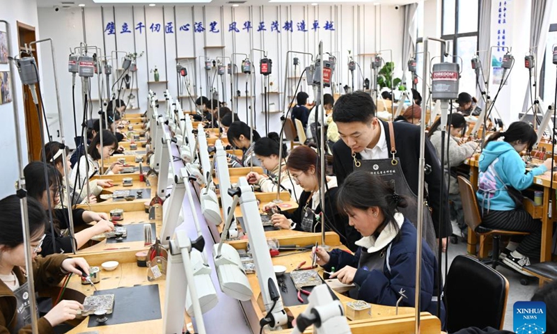 Students practice jewelry processing skills at a class in Qingdao Preschool Education College in Qingdao, east China's Shandong Province, March 31, 2026. (Xinhua/Li Ziheng)
