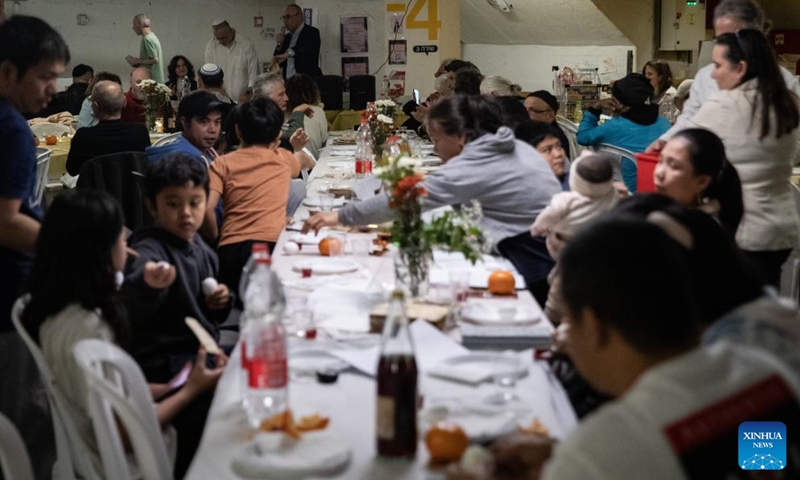 People hold a Passover Seder at an underground shelter in Tel Aviv, Israel, April 1, 2026. The week-long Jewish holiday of Passover began at sunset on April 1 and will end at sunset on April 8. As the military conflict continues, some Israelis chose to observe the traditional holiday meal in protective facilities. (Xinhua/Chen Junqing)

