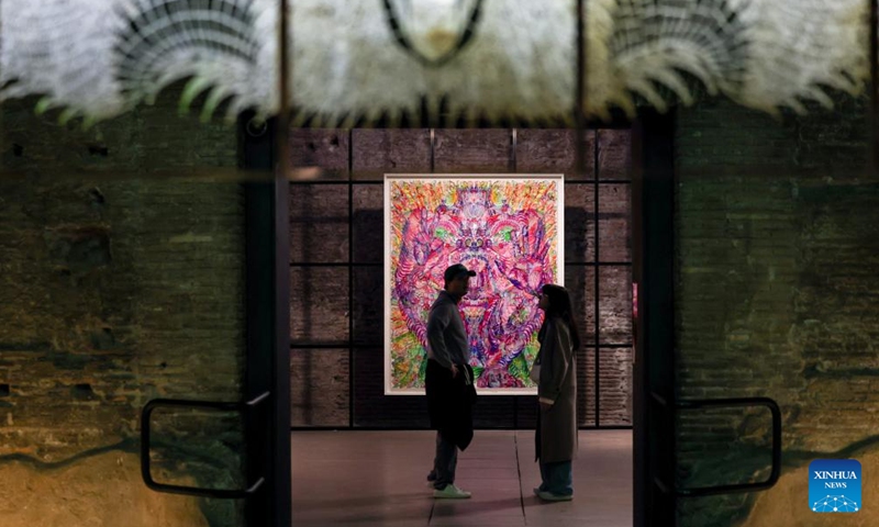People visit the exhibition Metamorphosis in Baths of Diocletian of the National Roman Museum in Rome, Italy, April 1, 2026. The exhibition presents the contemporary Chinese artist Wu Jian'an's reflection on the theme of transformation through a dialogue between Eastern and Western traditions. (Xinhua/Wang Kaiyan)

