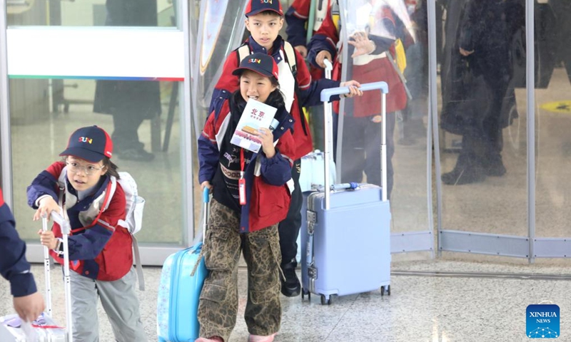 Students line up for a trip at Changzhou North Railway Station in Changzhou, east China's Jiangsu Province, April 1, 2026. As spring blossoms across China, primary and secondary school students in several regions are set for their first-ever spring break, which will see them heading beyond the classroom to travel and engage in a wide range of activities. (Photo by Chen Wei/Xinhua)

