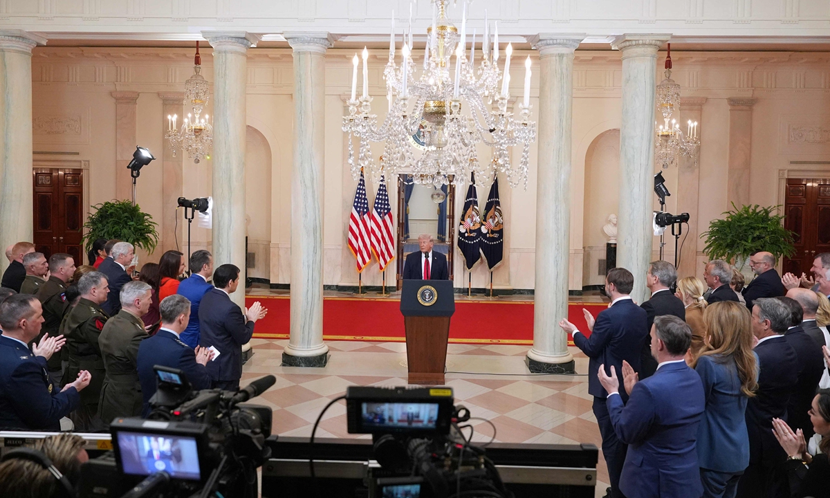Guests applaud as US President Donald Trump concludes his televised address on the conflict in the Middle East from the Cross Hall of the White House in Washington, DC on April 1, 2026. Photo: VCG