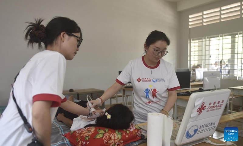 Chinese doctors check heart's health for a student at a primary school in Kampot, Cambodia, April 2, 2026. (Xinhua/Wu Changwei)

