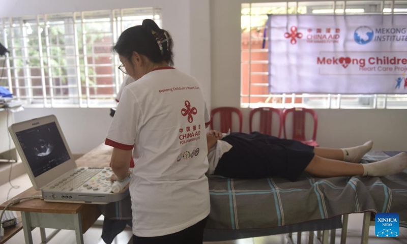 A Chinese doctor checks heart's health for a student at a primary school in Kampot, Cambodia, April 2, 2026. (Xinhua/Wu Changwei)

