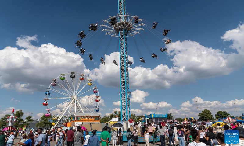 Visitors take amusement rides during the Rand Show 2026 in Johannesburg, South Africa, April 2, 2026. The Rand Show, an annual entertainment and shopping extravaganza in South Africa, is held from April 2 to 6 at the Johannesburg Expo Center. (Photo by Shiraaz Mohamed/Xinhua)