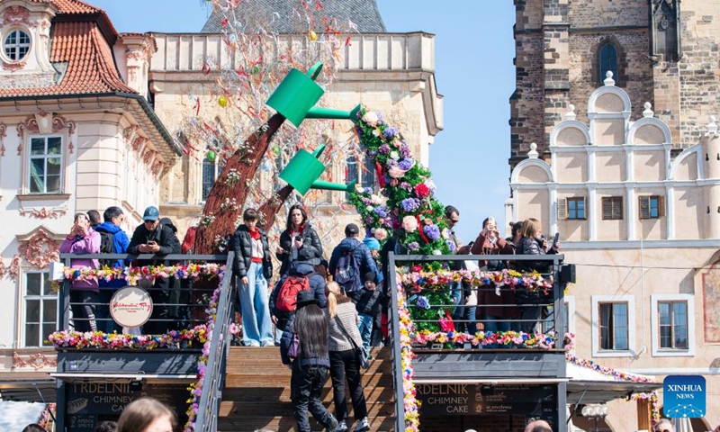 People visit an Easter market in Prague, the Czech Republic, April 2, 2026. As Easter approaches, a market is held in Prague's old city, attracting residents and tourists to experience the festive atmosphere. (Photo by Dana Kesnerova/Xinhua)