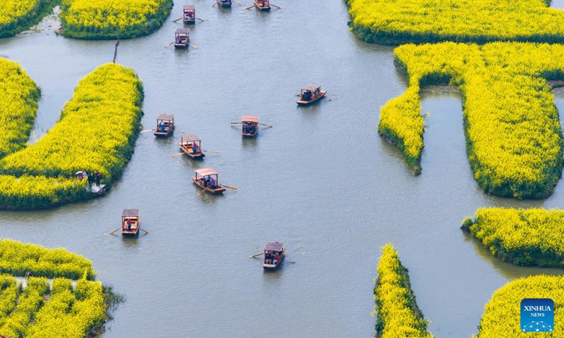 An aerial drone photo taken on April 2, 2026 shows tourists enjoying their leisure time at a scenic area in Xinghua City, east China's Jiangsu Province. (Photo by Yang Suping/Xinhua)