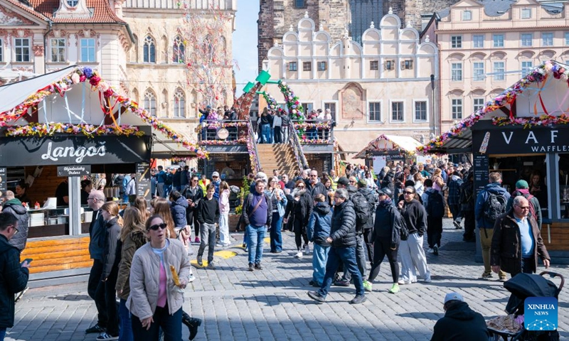 People visit an Easter market in Prague, the Czech Republic, April 2, 2026. As Easter approaches, a market is held in Prague's old city, attracting residents and tourists to experience the festive atmosphere. (Photo by Dana Kesnerova/Xinhua)