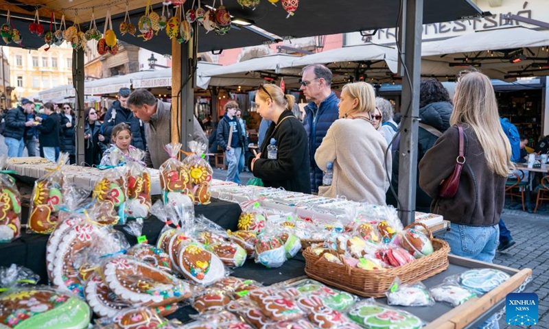 People visit an Easter market in Prague, the Czech Republic, April 2, 2026. As Easter approaches, a market is held in Prague's old city, attracting residents and tourists to experience the festive atmosphere. (Photo by Dana Kesnerova/Xinhua)