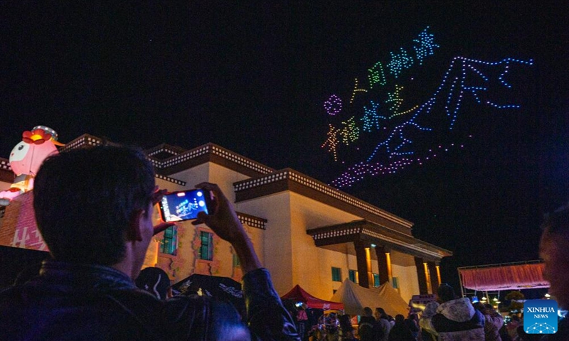 People watch a drone show at the opening ceremony of a peach blossom tourism and cultural festival in Nyingchi, southwest China's Xizang Autonomous Region, April 3, 2026. A peach blossom tourism and cultural festival kicked off in Nyingchi on Friday. More than 20 activities are scheduled to be held during the event. (Xinhua/Tenzin Nyida)