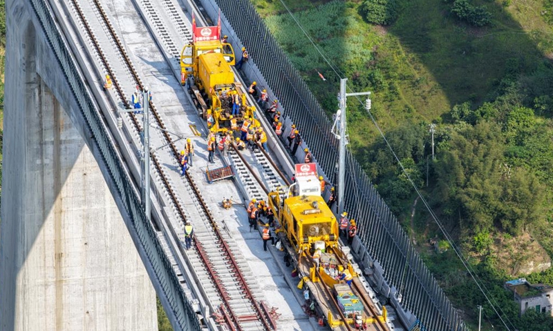 An aerial drone photo taken on April 3, 2026 shows a construction site of the Chongqing-Wanzhou high-speed railway during its track-laying phase in southwest China's Chongqing Municipality. The construction of the Chongqing-Wanzhou high-speed railway entered the track-laying phase on Friday. With a designed speed of 350 kilometers per hour, the high-speed railway stretches 251 kilometers from Chongqing East Railway Station to Wanzhou North Railway Station. (Xinhua/Tang Yi)
