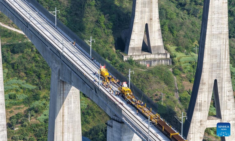An aerial drone photo taken on April 3, 2026 shows a construction site of the Chongqing-Wanzhou high-speed railway during its track-laying phase in southwest China's Chongqing Municipality. The construction of the Chongqing-Wanzhou high-speed railway entered the track-laying phase on Friday. With a designed speed of 350 kilometers per hour, the high-speed railway stretches 251 kilometers from Chongqing East Railway Station to Wanzhou North Railway Station. (Xinhua/Tang Yi)