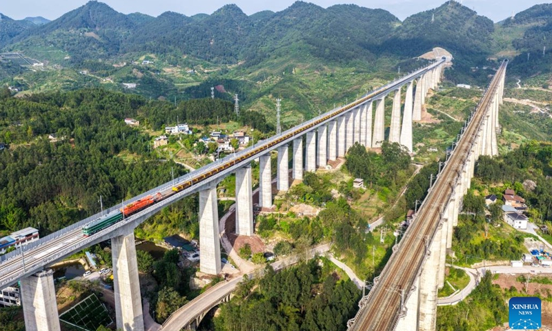 An aerial drone photo taken on April 3, 2026 shows a construction site of the Chongqing-Wanzhou high-speed railway during its track-laying phase in southwest China's Chongqing Municipality. The construction of the Chongqing-Wanzhou high-speed railway entered the track-laying phase on Friday. With a designed speed of 350 kilometers per hour, the high-speed railway stretches 251 kilometers from Chongqing East Railway Station to Wanzhou North Railway Station. (Xinhua/Tang Yi)